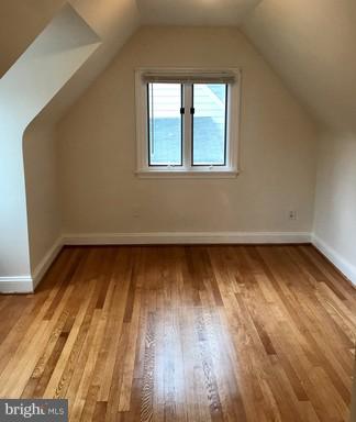8905 Flower Avenue Silver Spring, MD 20901 - Photo 7 of 17 a view of a room with wooden floor and window
