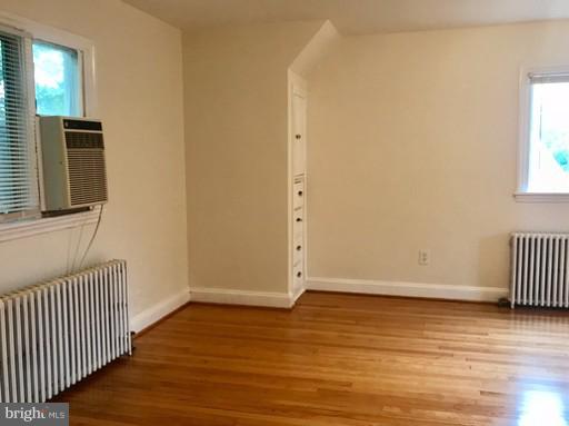 8905 Flower Avenue Silver Spring, MD 20901 - Photo 9 of 17 an empty room with wooden floor and windows