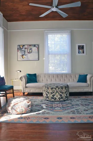 a living room with furniture and a rug