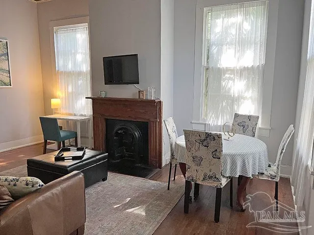 a living room with furniture and a fireplace