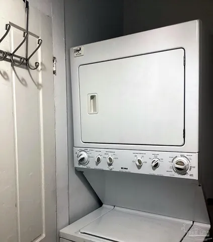 a view of a bathroom with a sink a toilet and a window