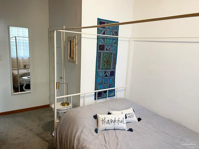 a white toilet sitting next to a bathroom sink