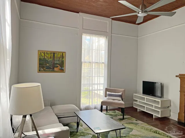 a living room with furniture and a window