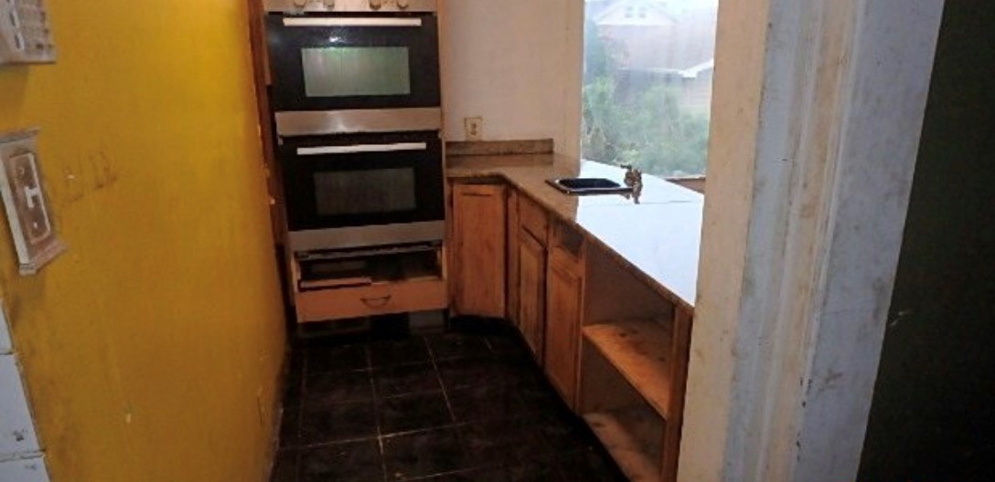 8217 South Rhodes Avenue Chicago, IL 60619 - Photo 11 of 22 a bathroom with a sink and a mirror