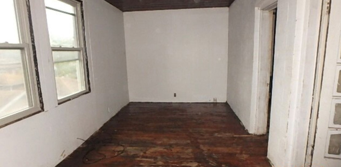 8217 South Rhodes Avenue Chicago, IL 60619 - Photo 4 of 22 an empty room with windows