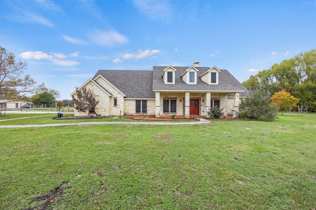 701 Rock Ridge Road Allen, TX 75002 - Photo 1 of 1 Cape cod home with a front yard and covered porch