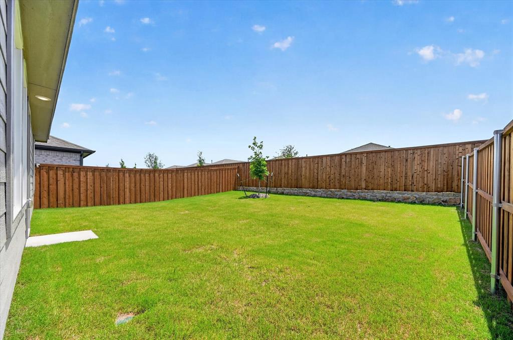 1516 Prince Road Howe, TX 75459 - Photo 24 of 28 a view of a backyard with wooden fence