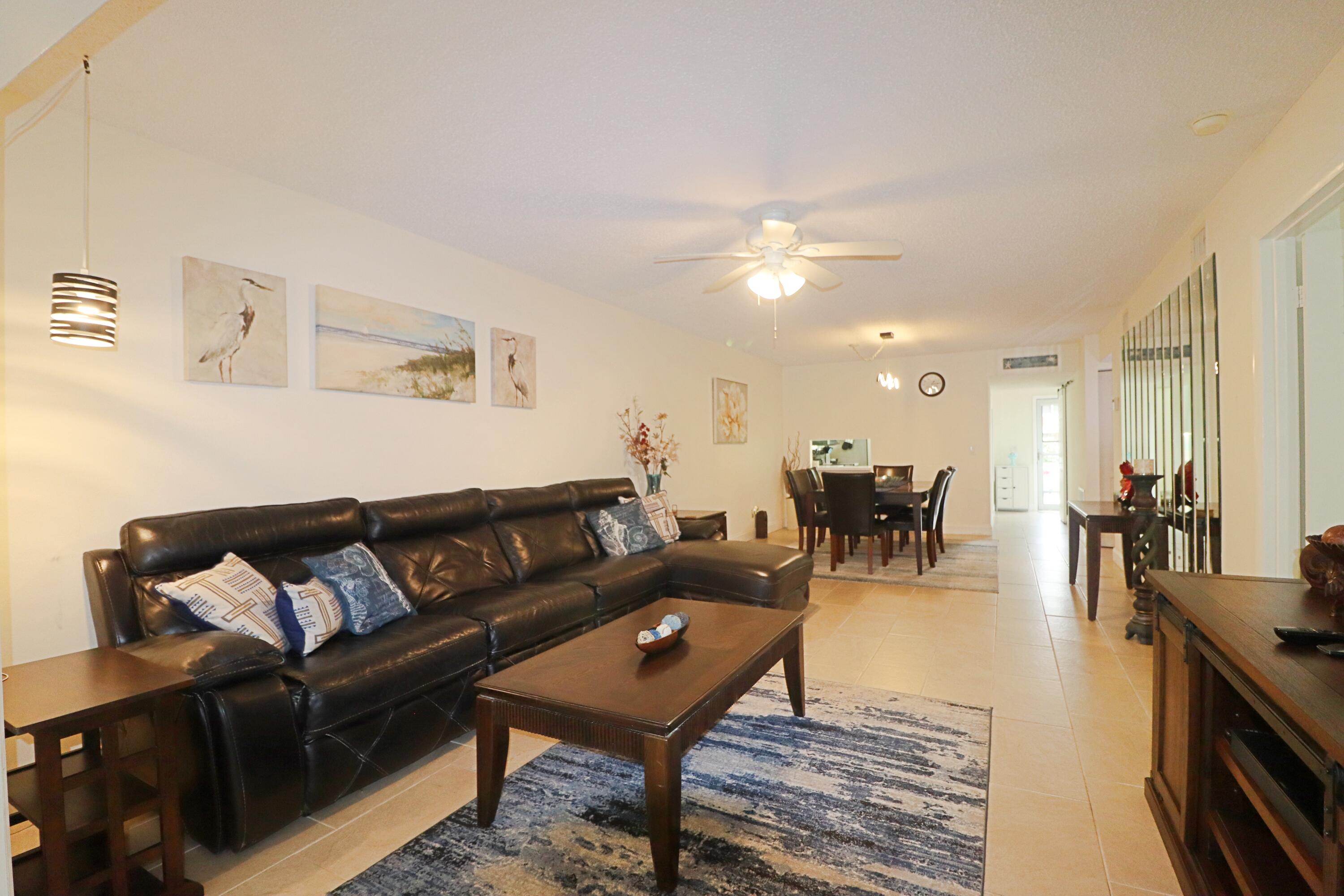 133 Lakes End Drive, Unit E1 Fort Pierce, FL 34982 - Photo 7 of 29 a living room with furniture