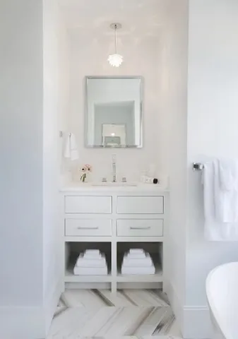 a bathroom with a sink and a mirror