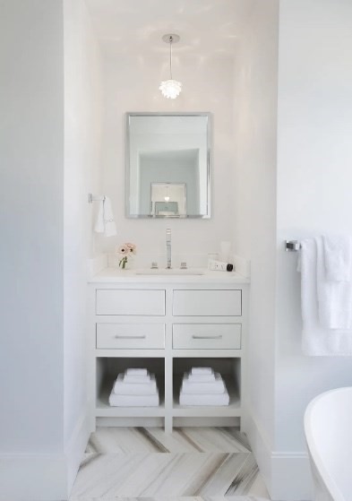 21 Woodbine Street Nantucket, MA 02554 - Photo 11 of 19 a bathroom with a sink and a mirror
