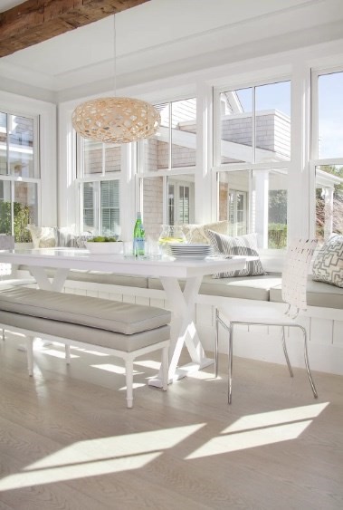 21 Woodbine Street Nantucket, MA 02554 - Photo 12 of 19 a living room with a large window cabinets and chandelier