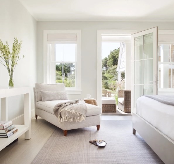 21 Woodbine Street Nantucket, MA 02554 - Photo 15 of 19 a bedroom with a bed and large windows