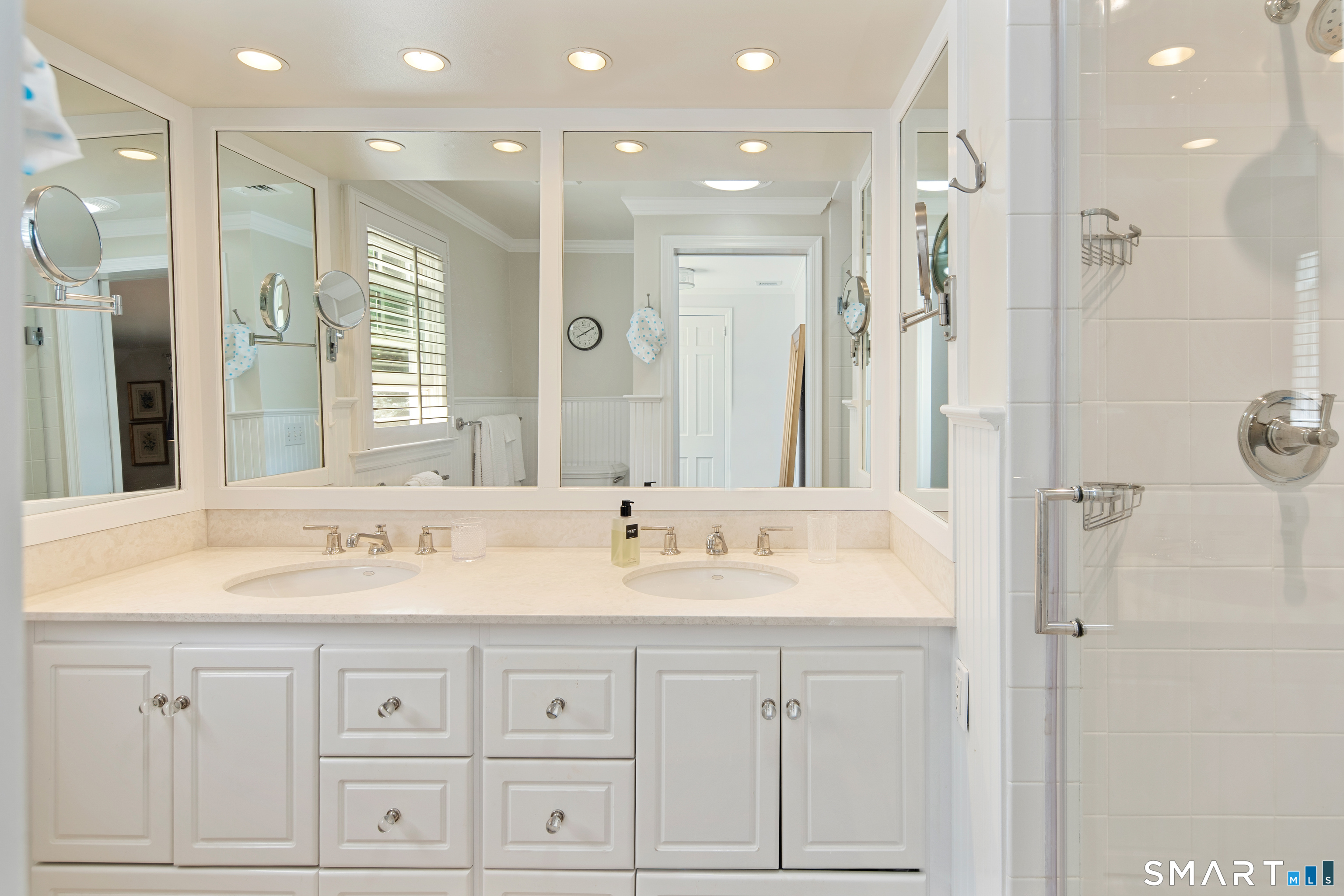 11 McLaren Road South Darien, CT 06820 - Photo 26 of 40 a bathroom with double sink and a mirror