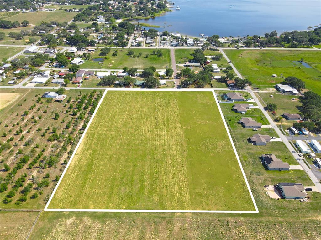 360 Swingle Street Frostproof, FL 33843 - Photo 7 of 27 a view of swimming pool with a yard