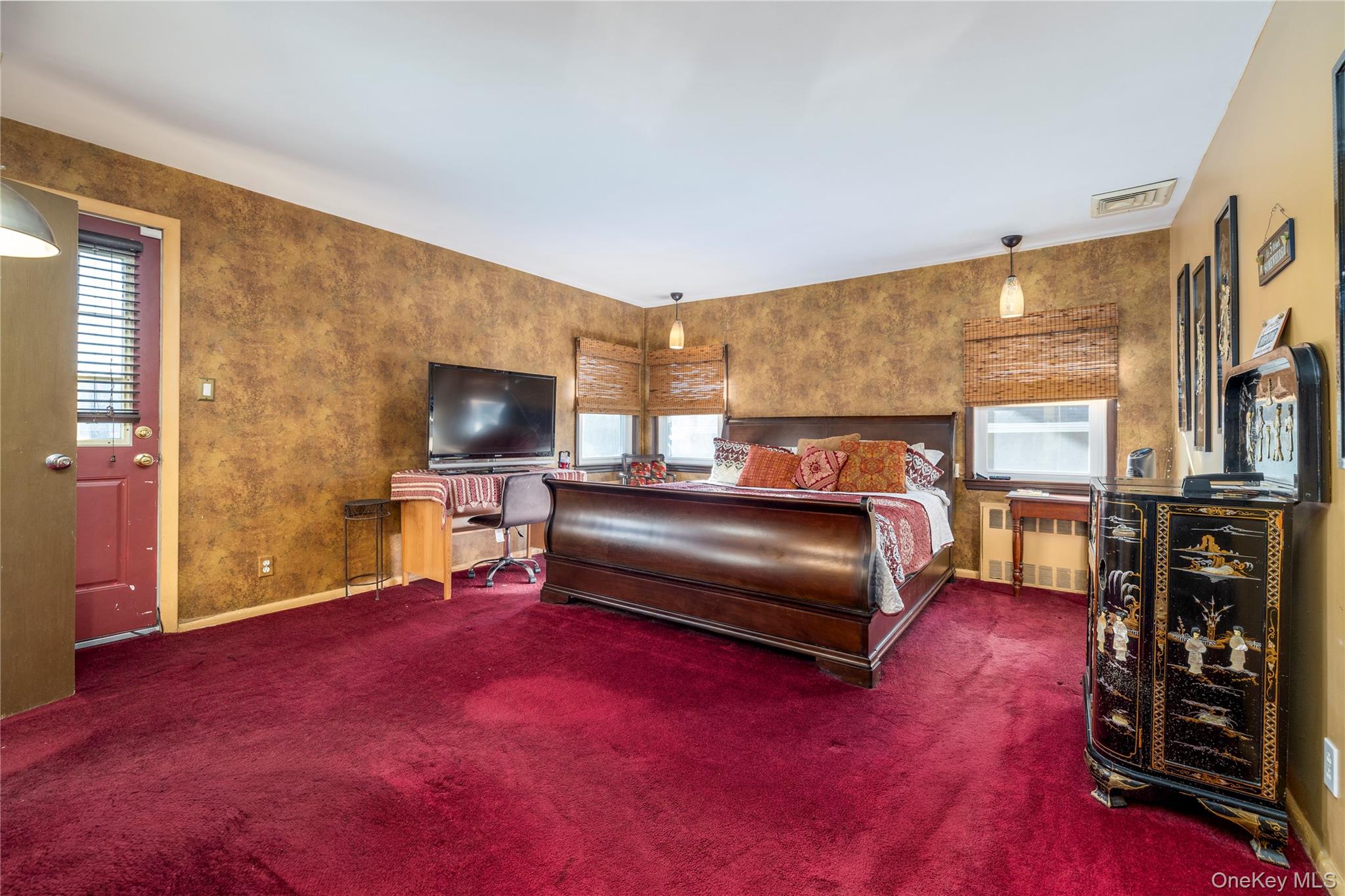 136 Greenway Road Lido Beach, NY 11561 - Photo 13 of 29 a bedroom with furniture and a flat screen tv