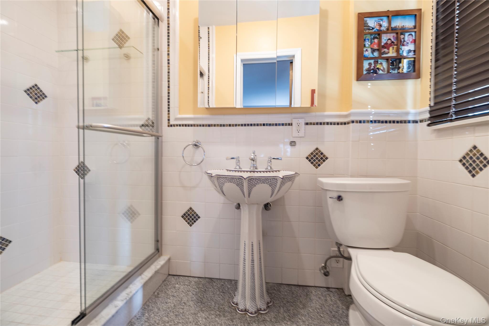 136 Greenway Road Lido Beach, NY 11561 - Photo 14 of 29 a bathroom with a toilet sink and shower