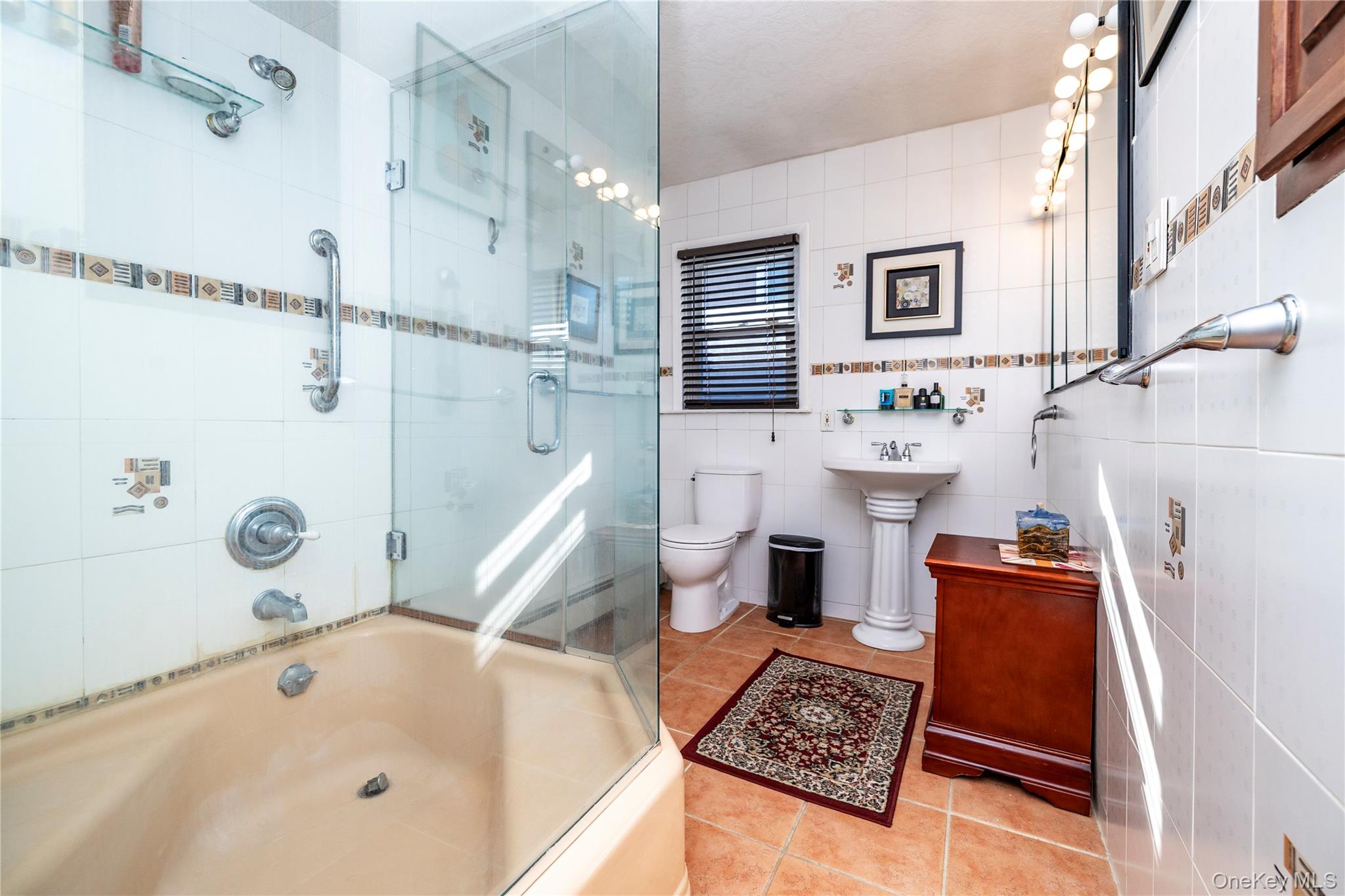 136 Greenway Road Lido Beach, NY 11561 - Photo 16 of 29 a bathroom with a bathtub and a shower