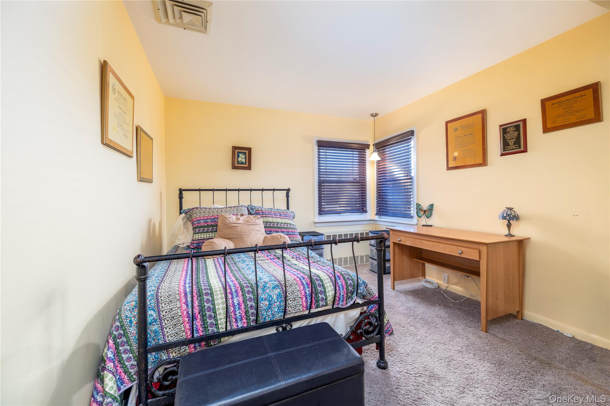 136 Greenway Road Lido Beach, NY 11561 - Photo 17 of 29 a view of a bedroom with furniture and windows