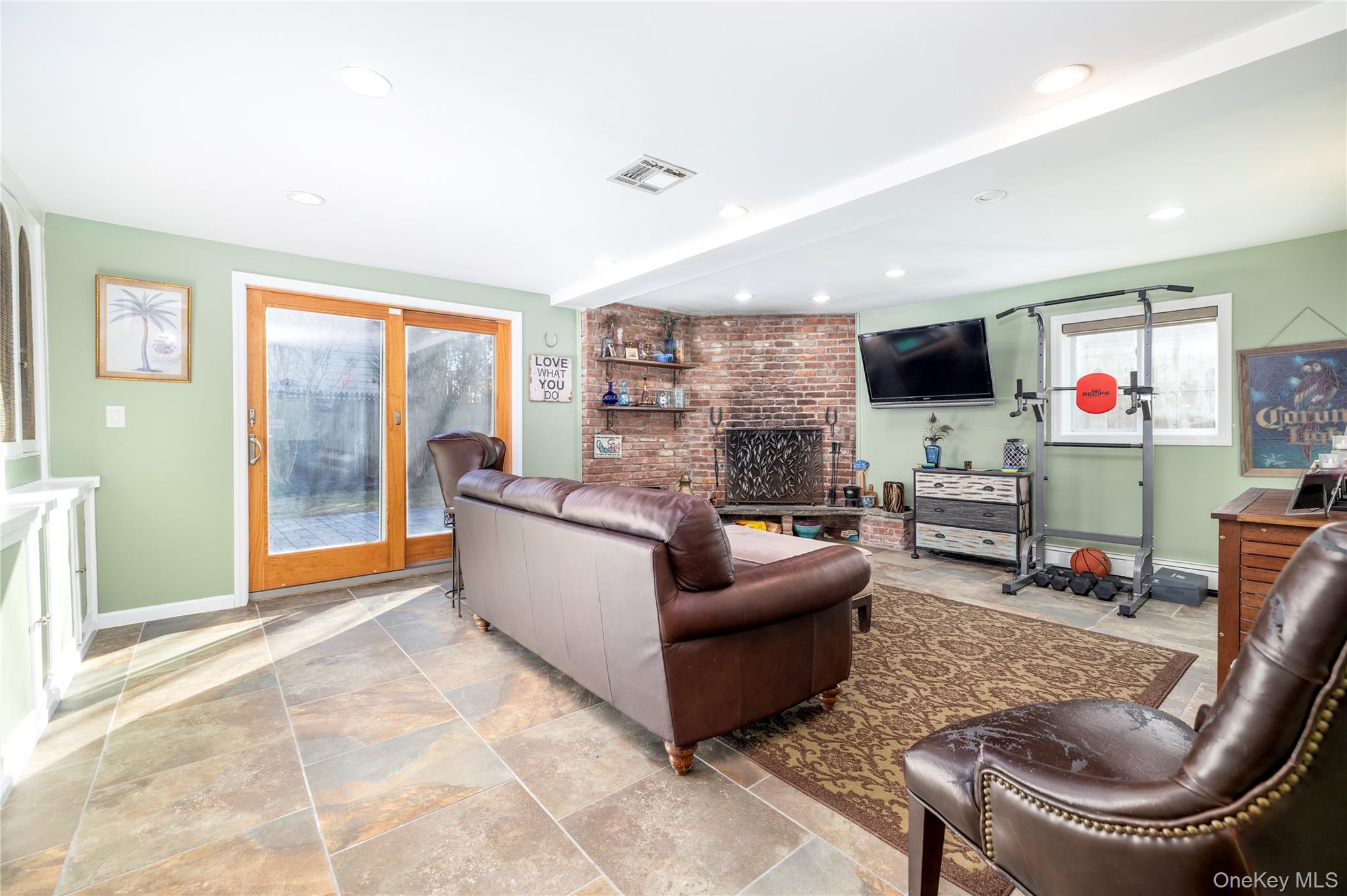 136 Greenway Road Lido Beach, NY 11561 - Photo 18 of 29 a living room with furniture and a fireplace