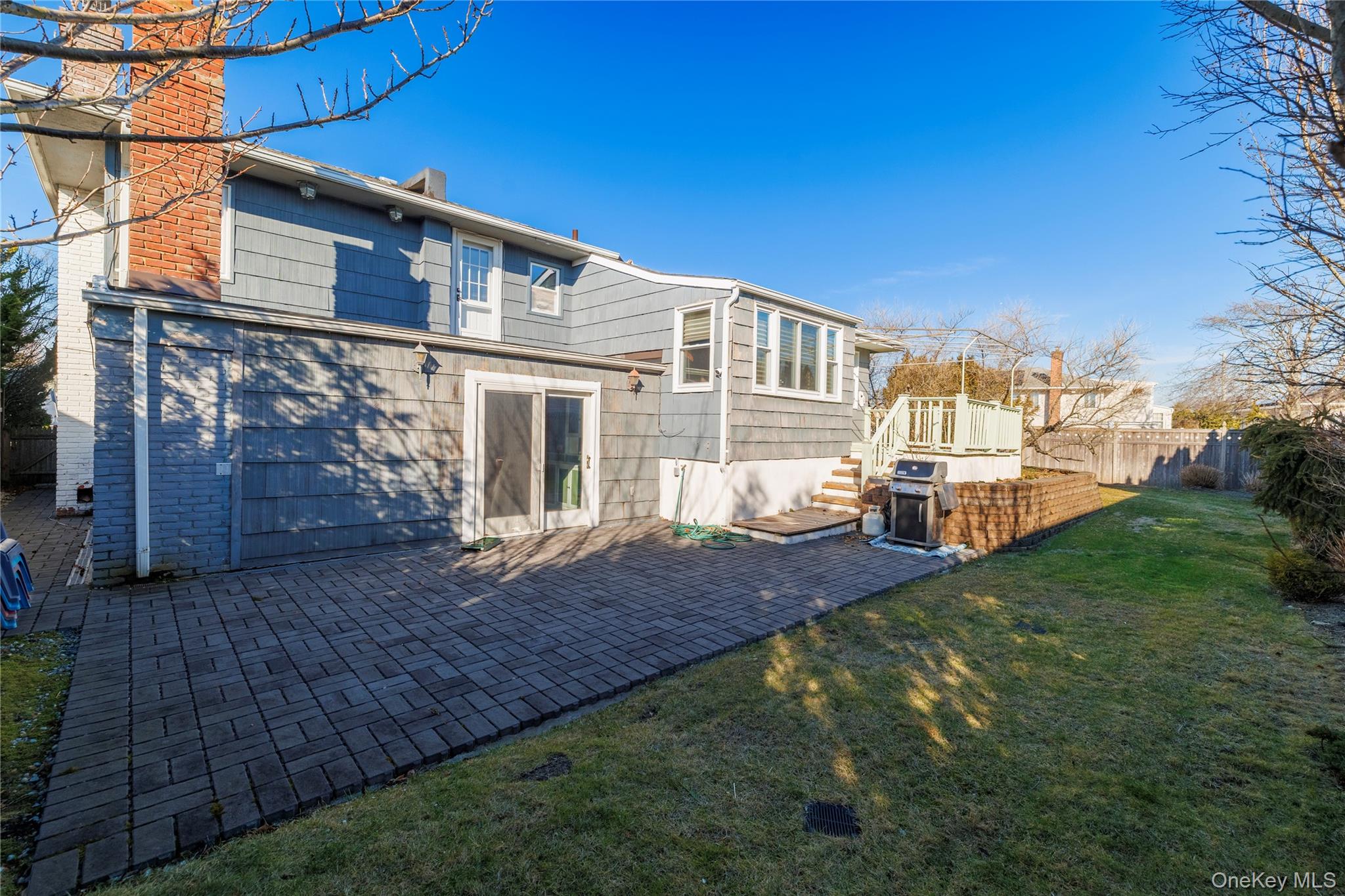 136 Greenway Road Lido Beach, NY 11561 - Photo 19 of 29 a view of a house with a yard