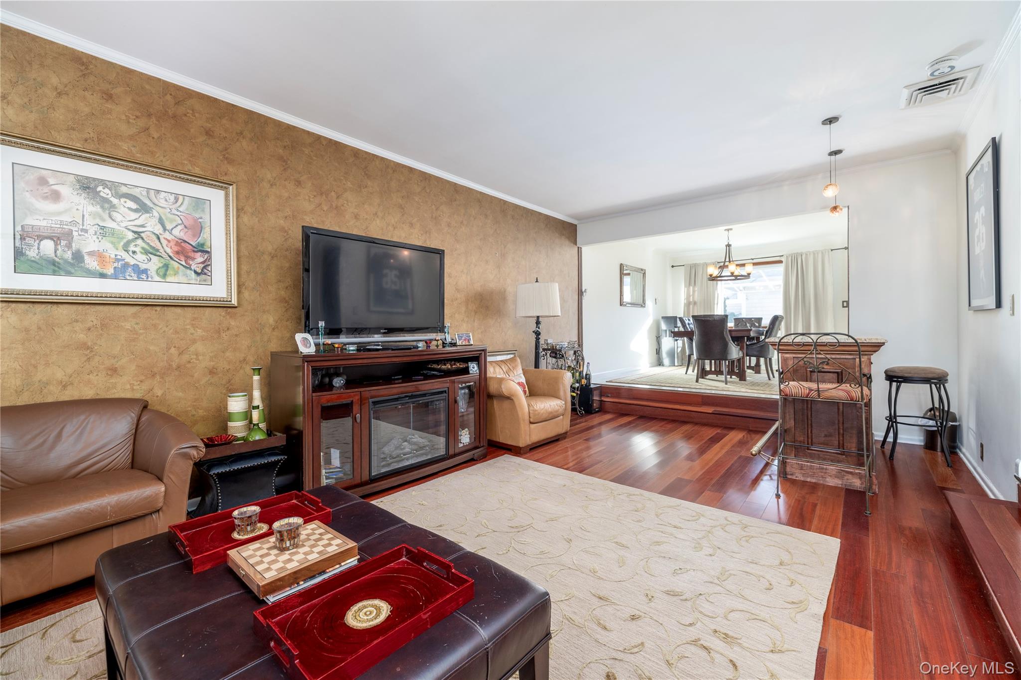136 Greenway Road Lido Beach, NY 11561 - Photo 5 of 29 a living room with furniture and a flat screen tv