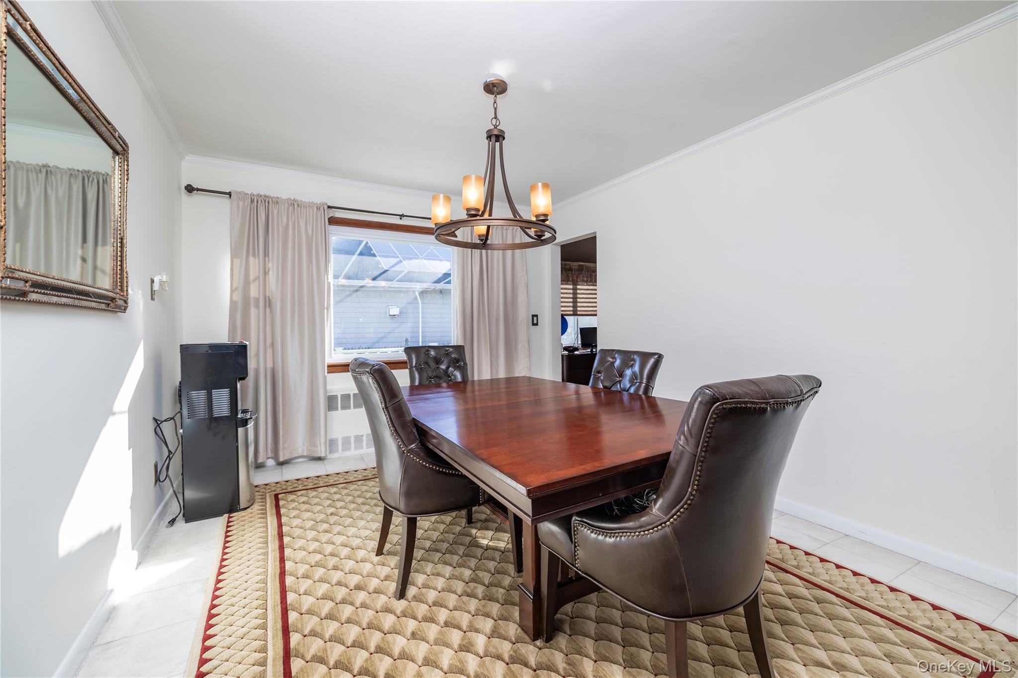 136 Greenway Road Lido Beach, NY 11561 - Photo 6 of 29 a dining room with furniture a chandelier and wooden floor