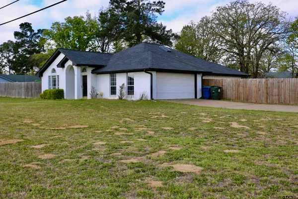 a house view with a garden space