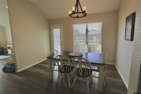 a view of a dining room with furniture window and outside view
