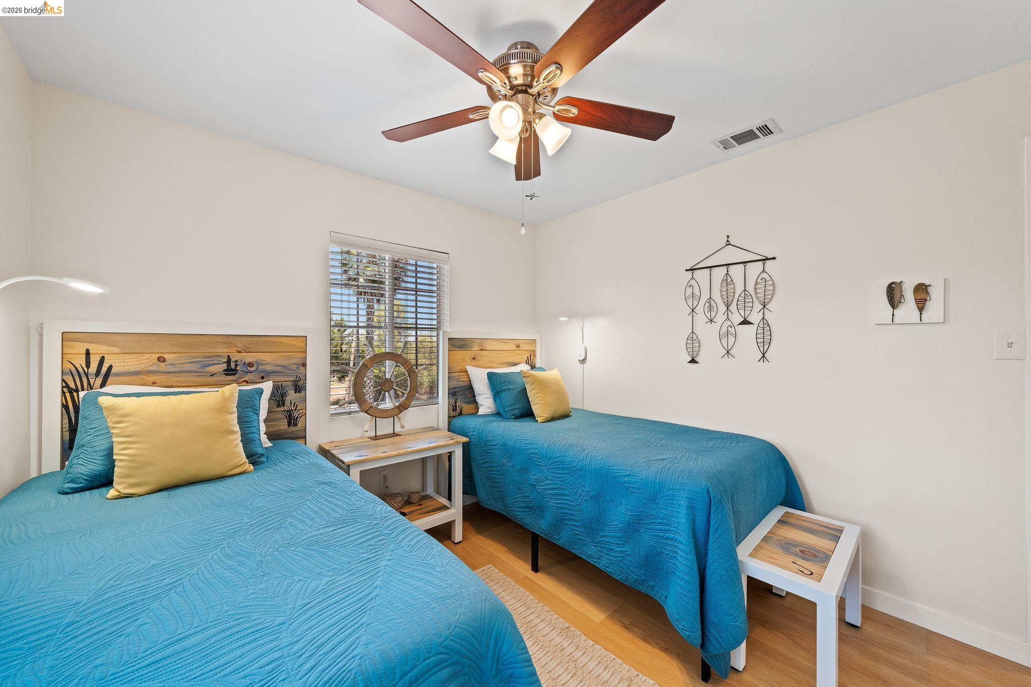 1704 Taylor Road Bethel Island, CA 94511 - Photo 39 of 73 Bright interior room featuring a wood-finish floor and white walls
