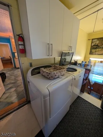 a bedroom with bed and a chandelier