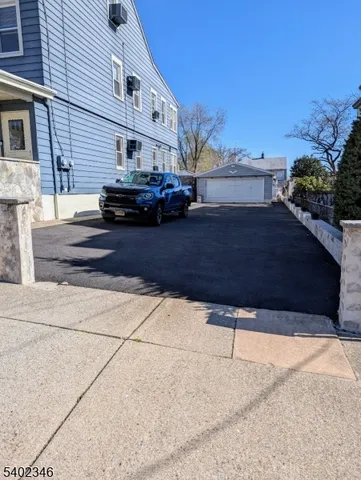 a view of building with car parked