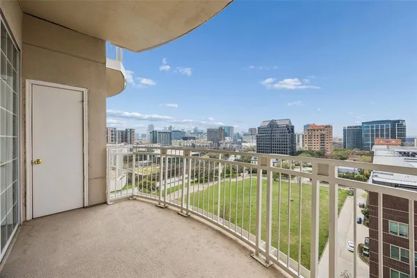 a view of a balcony with city