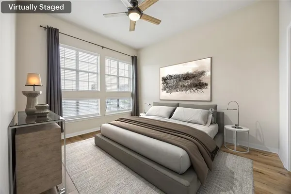 a spacious bedroom with a large bed and a window