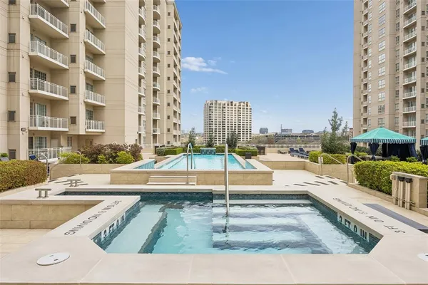 a view of swimming pool with outdoor seating