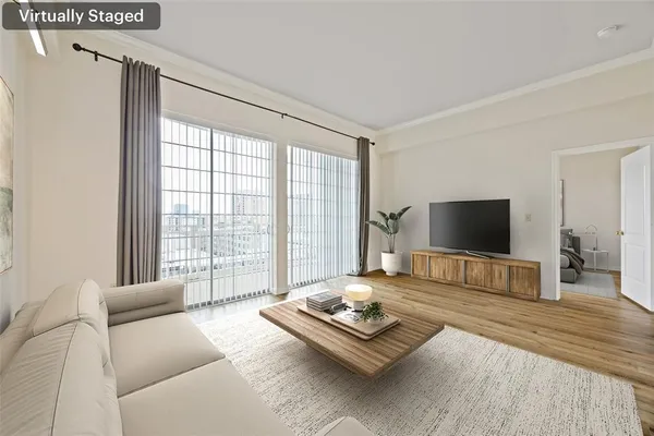 a living room with furniture and a flat screen tv