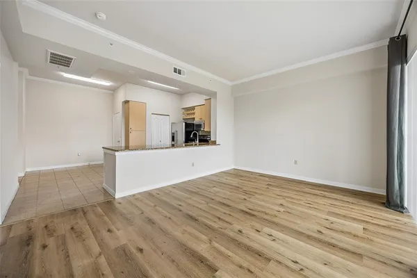 a view of a kitchen cabinets and a wooden floor