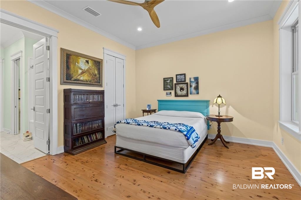 2730 Gator Road Mobile, AL 36605 - Photo 20 of 42 Bedroom with light wood-type flooring, crown molding, a ceiling fan, a closet, and recessed lighting