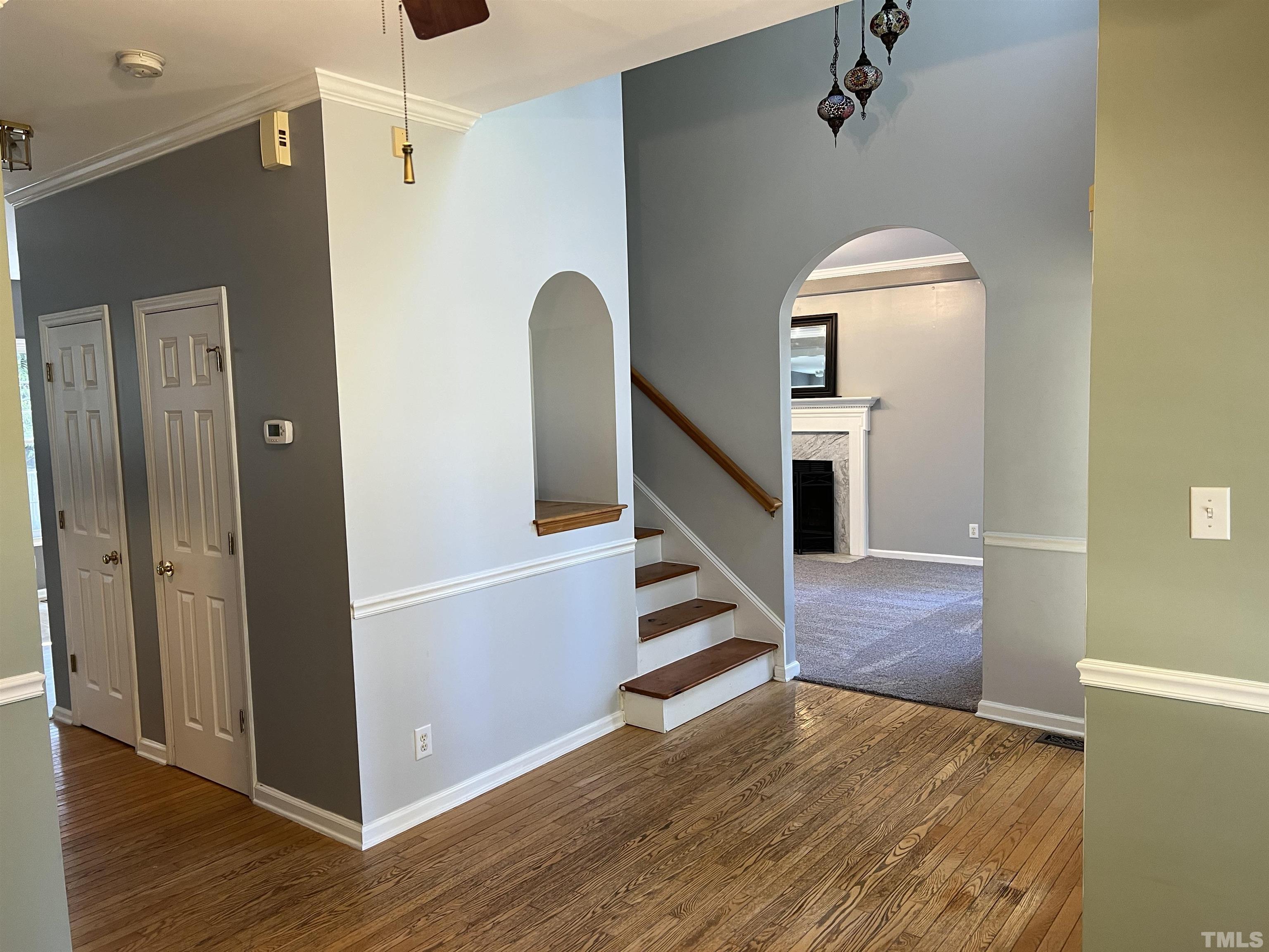 5113 Six Point Trail Raleigh, NC 27616 - Photo 17 of 53 a view of a hallway with wooden floor and staircase