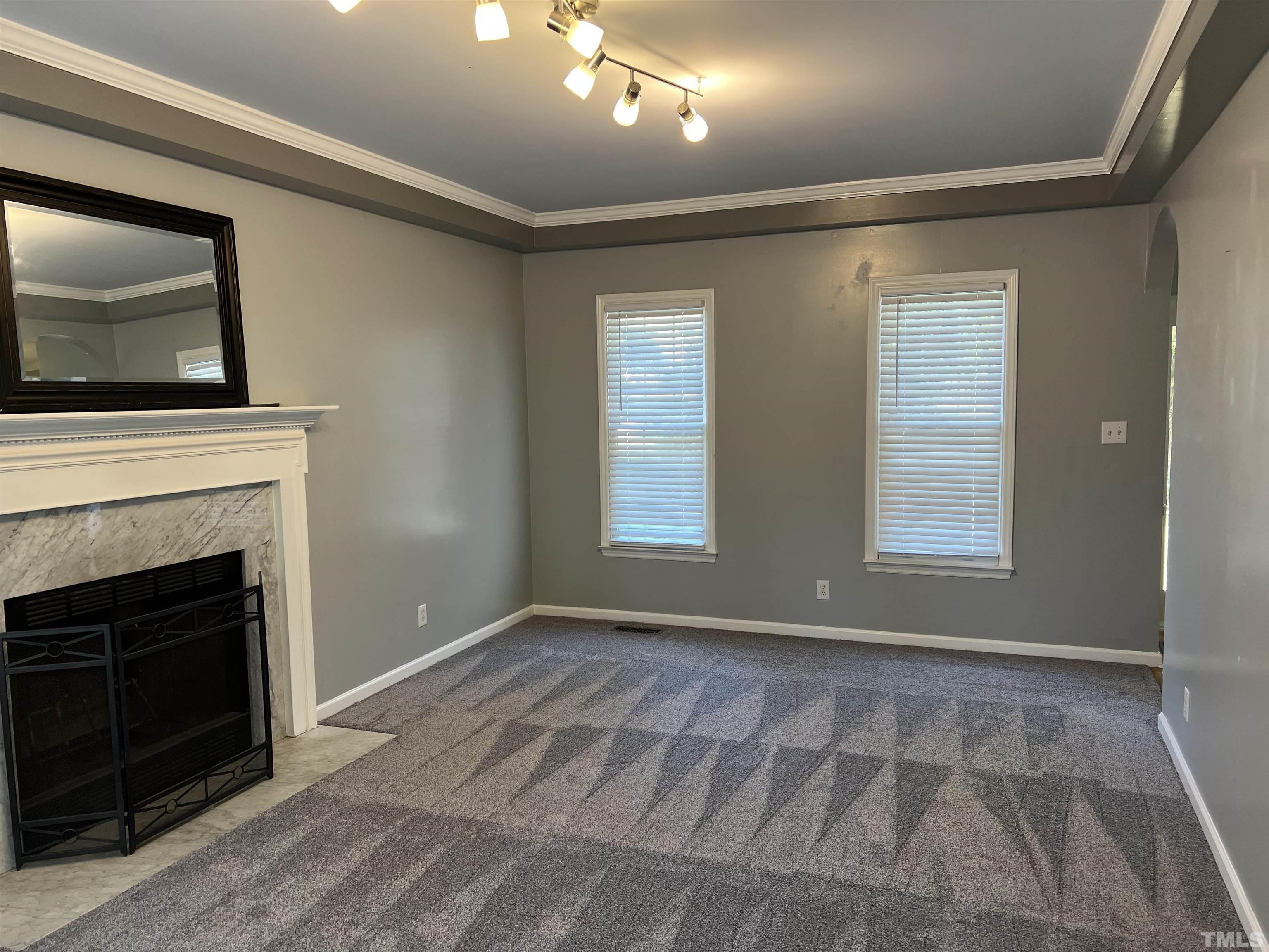 5113 Six Point Trail Raleigh, NC 27616 - Photo 21 of 53 a view of livingroom with window fireplace and window