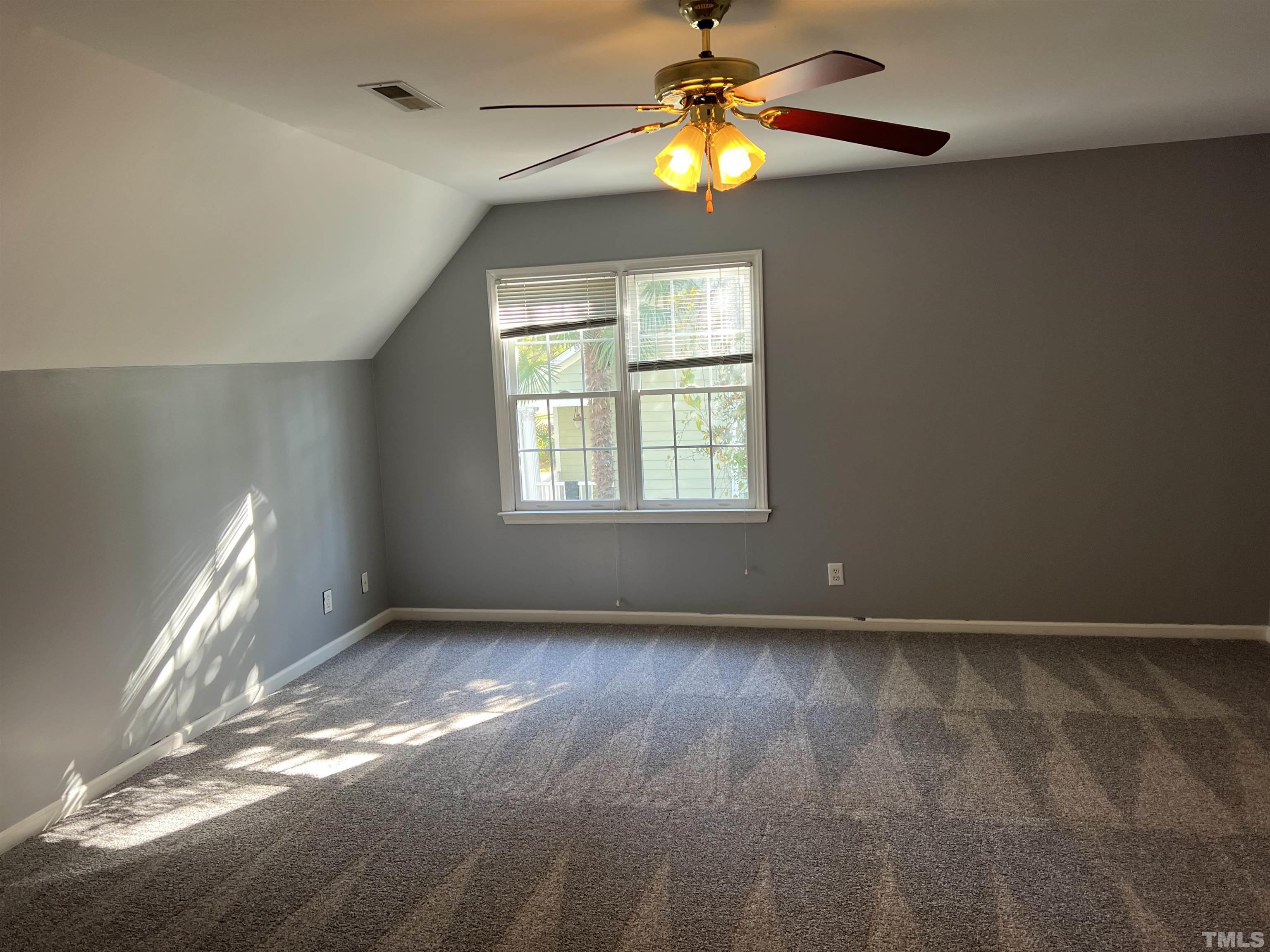 5113 Six Point Trail Raleigh, NC 27616 - Photo 35 of 53 a view of an empty room with window and chandelier fan
