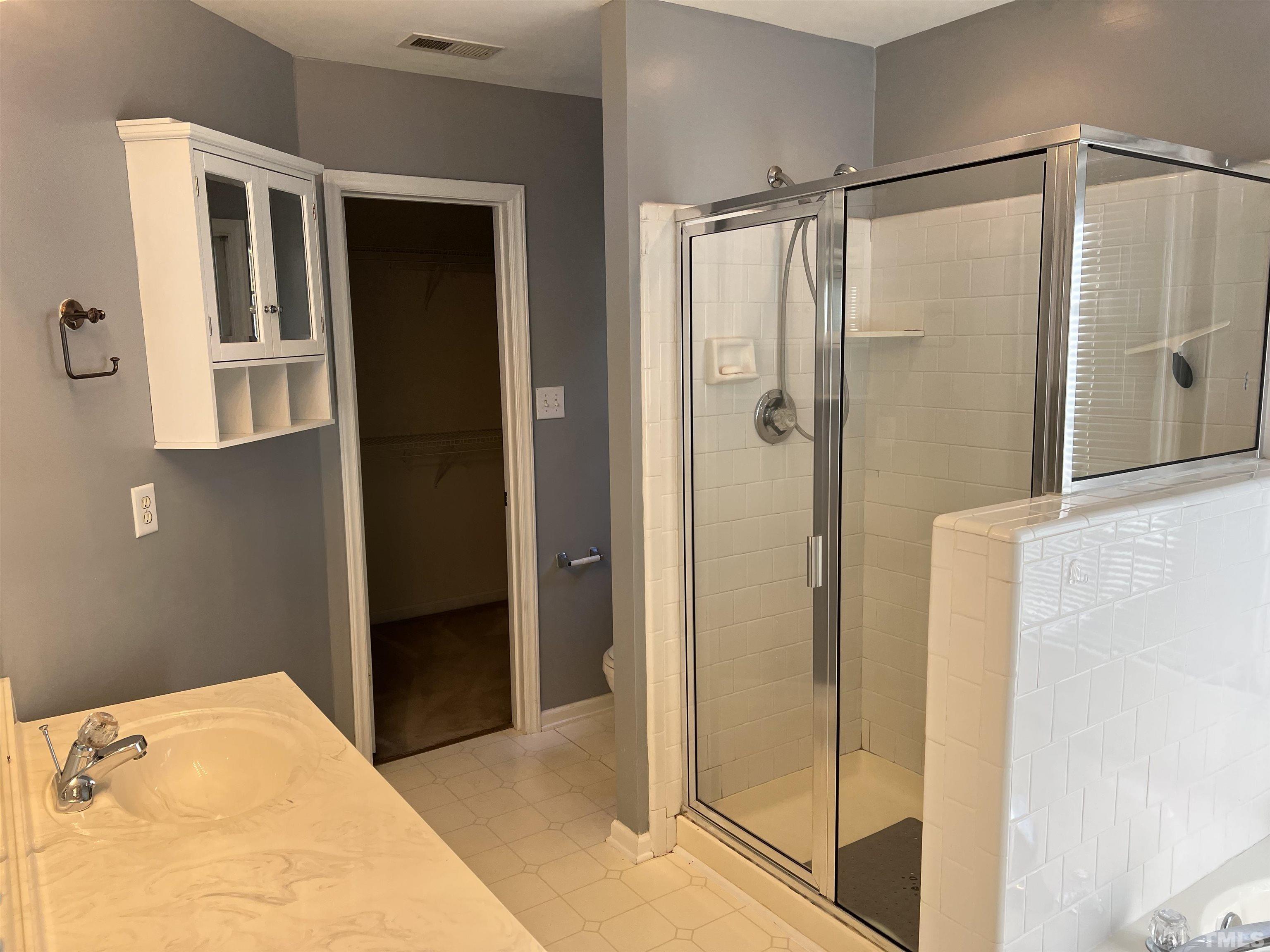 5113 Six Point Trail Raleigh, NC 27616 - Photo 41 of 53 a bathroom with a shower and a glass door