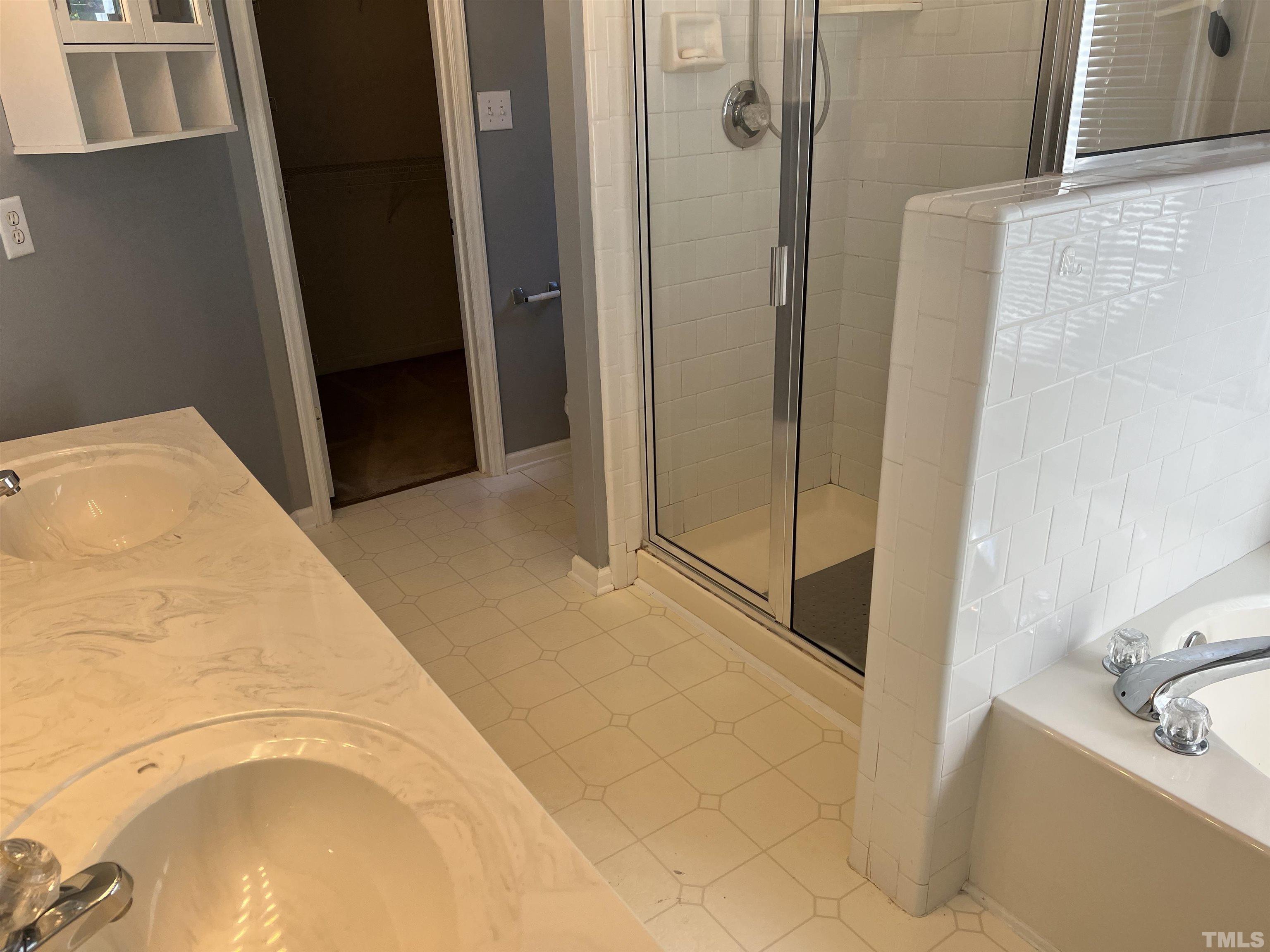 5113 Six Point Trail Raleigh, NC 27616 - Photo 42 of 53 a bathroom with a tub and shower