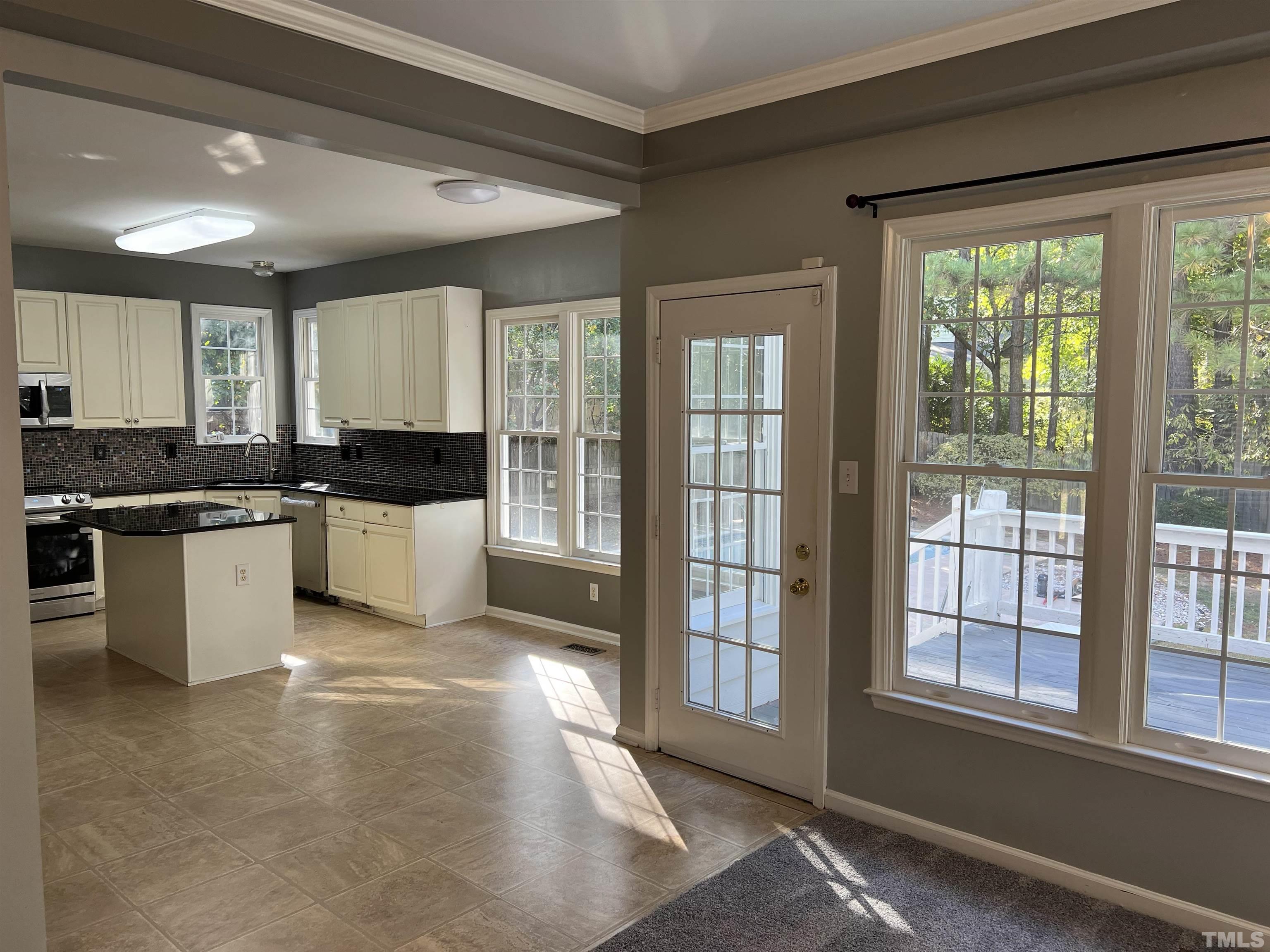5113 Six Point Trail Raleigh, NC 27616 - Photo 45 of 53 a large kitchen with stainless steel appliances granite countertop a stove a sink and a refrigerator