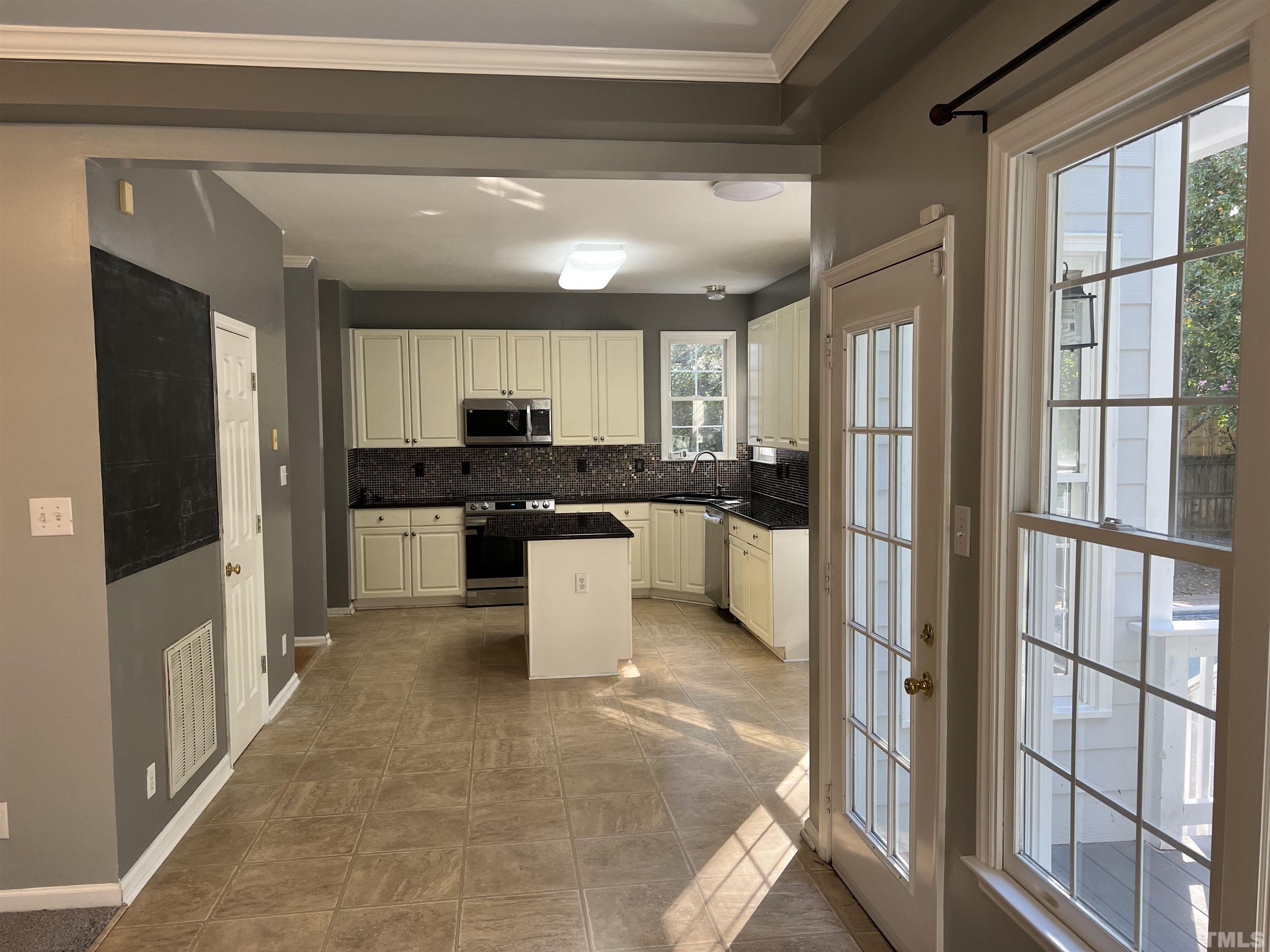 5113 Six Point Trail Raleigh, NC 27616 - Photo 47 of 53 a kitchen with stainless steel appliances granite countertop a refrigerator and a stove top oven