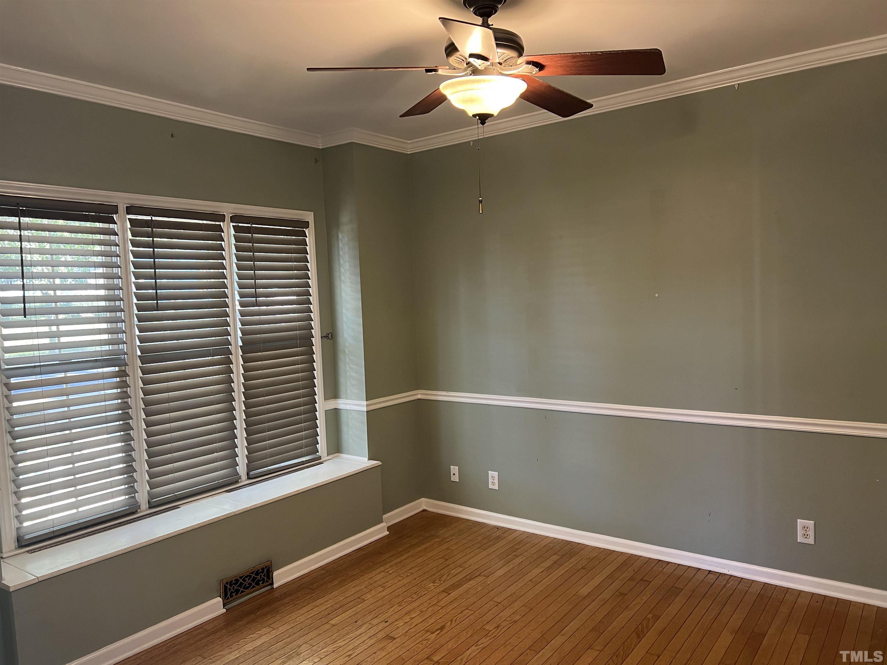 5113 Six Point Trail Raleigh, NC 27616 - Photo 10 of 53 an empty room with wooden floor and windows