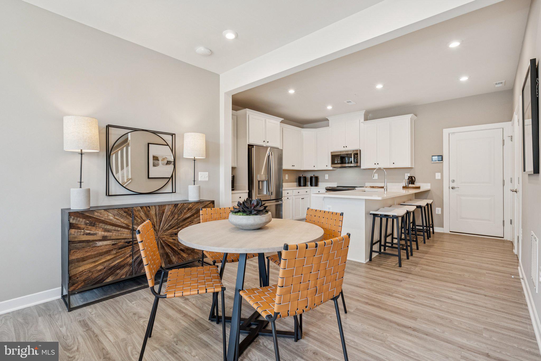 13729 Cobble Loop Woodbridge, VA 22193 - Photo 6 of 28 a view of a dining room with furniture and wooden floor