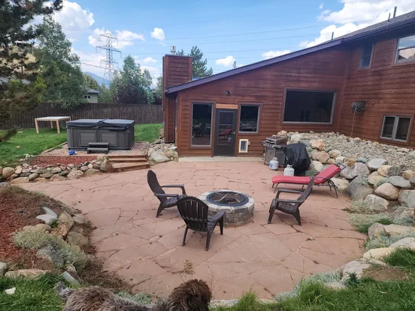 a view of a backyard with furniture