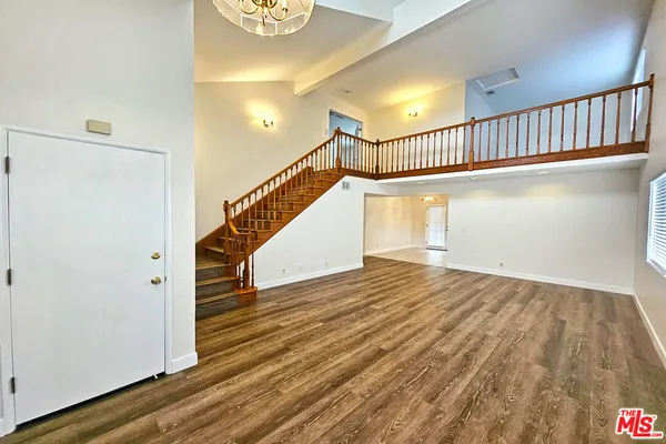 a view of entryway with wooden floor
