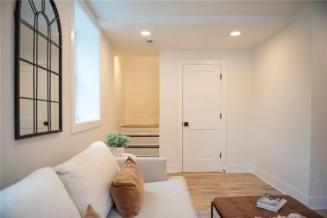 a kitchen with stainless steel appliances granite countertop a stove a sink and a granite counter tops with wooden floors