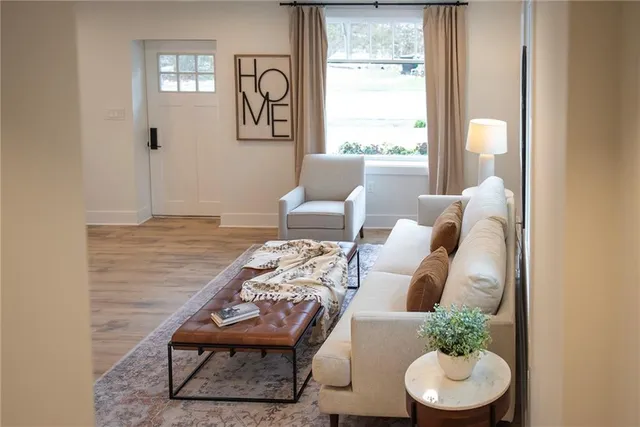 a view of a dining room with furniture window and wooden floor